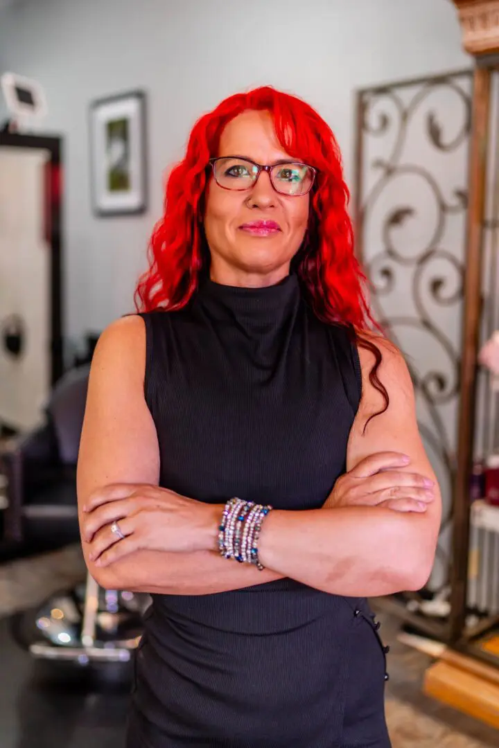 Person with red hair in a salon.