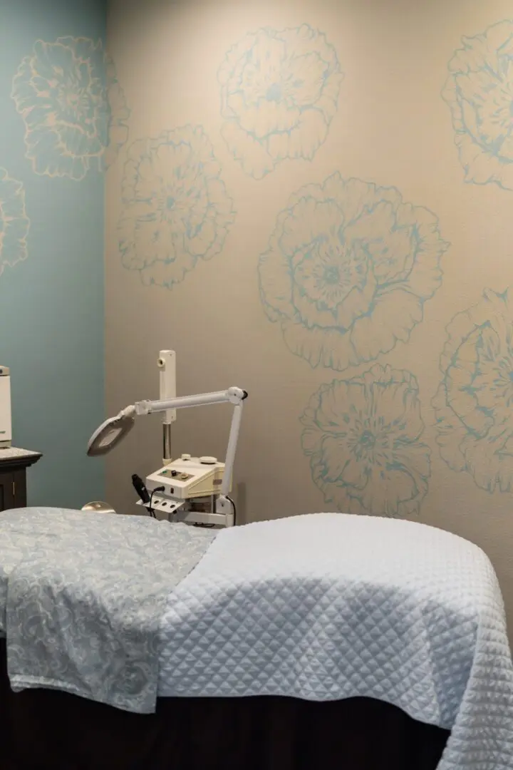 Spa room with treatment table and decor.